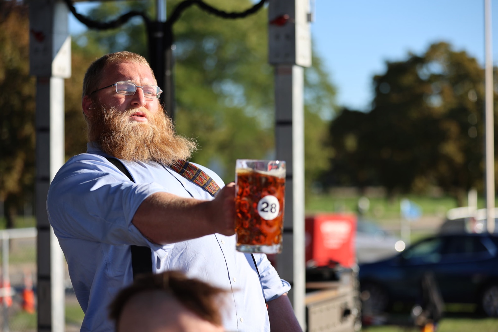 Jack Carter holding a full stein at arm's length during the competition