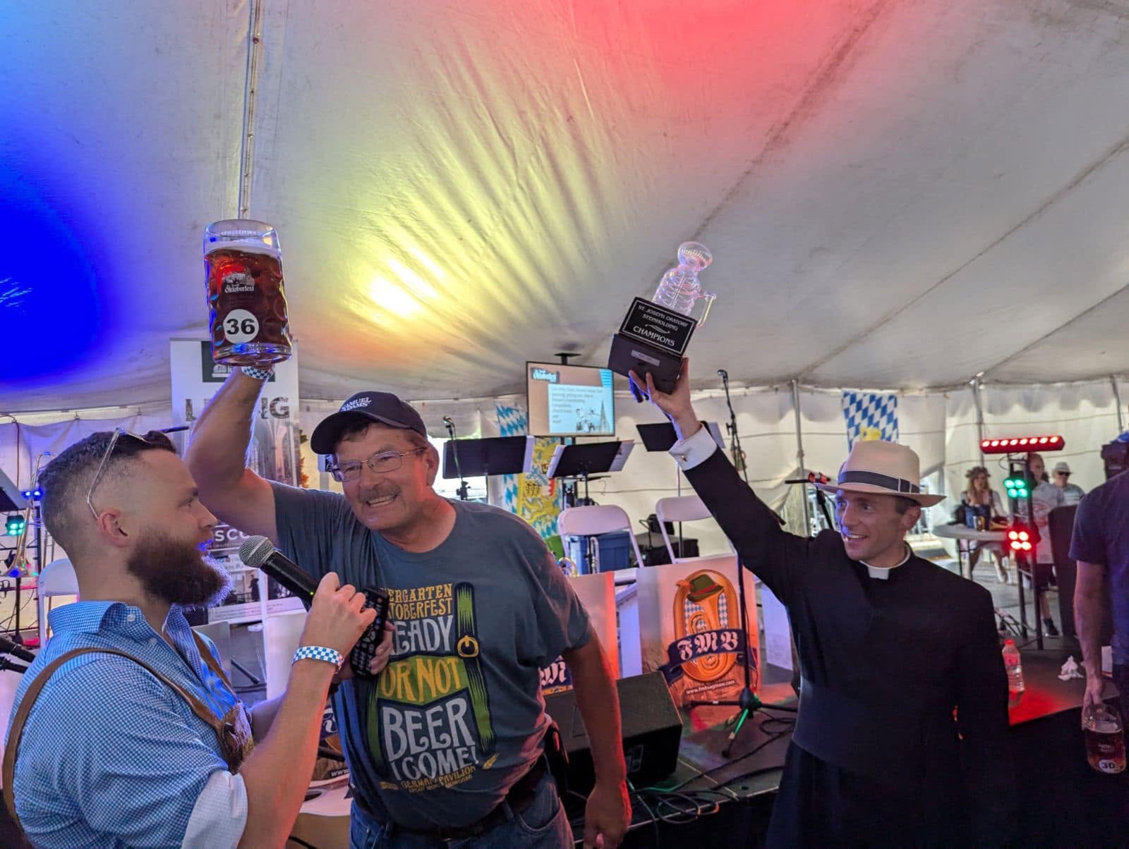 Mark Kaiser raising his stein as the Canon lifts the Steinly Cup